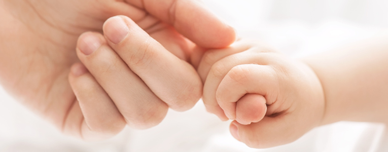 Child Holding Parent's Finger